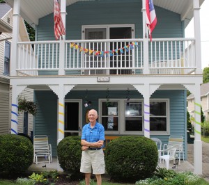 Dad in front of the decorated cottage at Lakeside